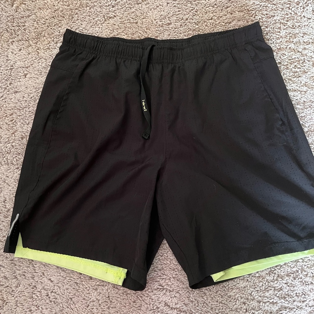 Athletic Black and Green Performance Shorts with Moisture-Wicking Material